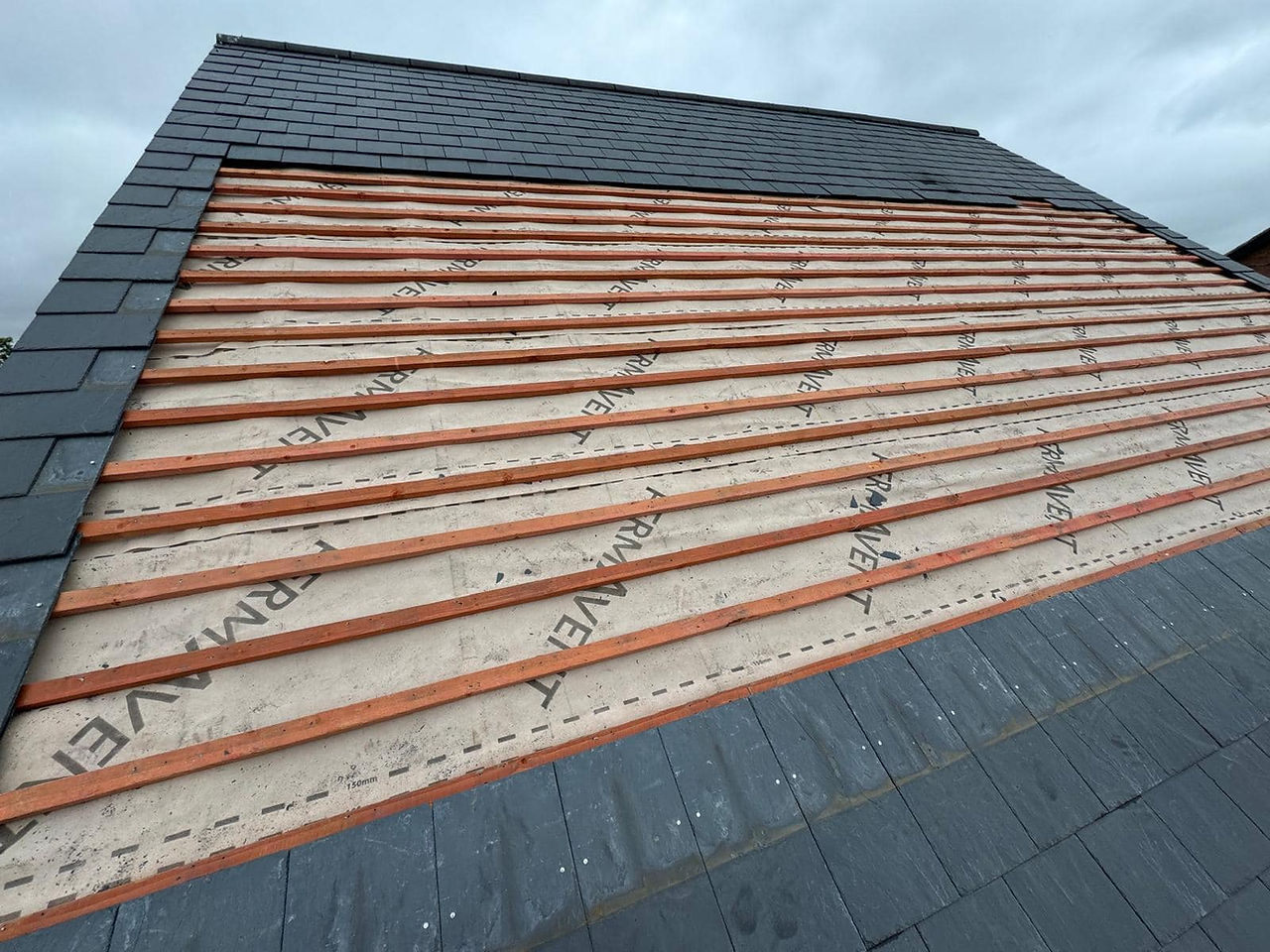 Removing slate roof ready to install inline solar panels