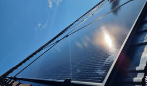 Solar Panels with sunshine on a roof in swadlincote