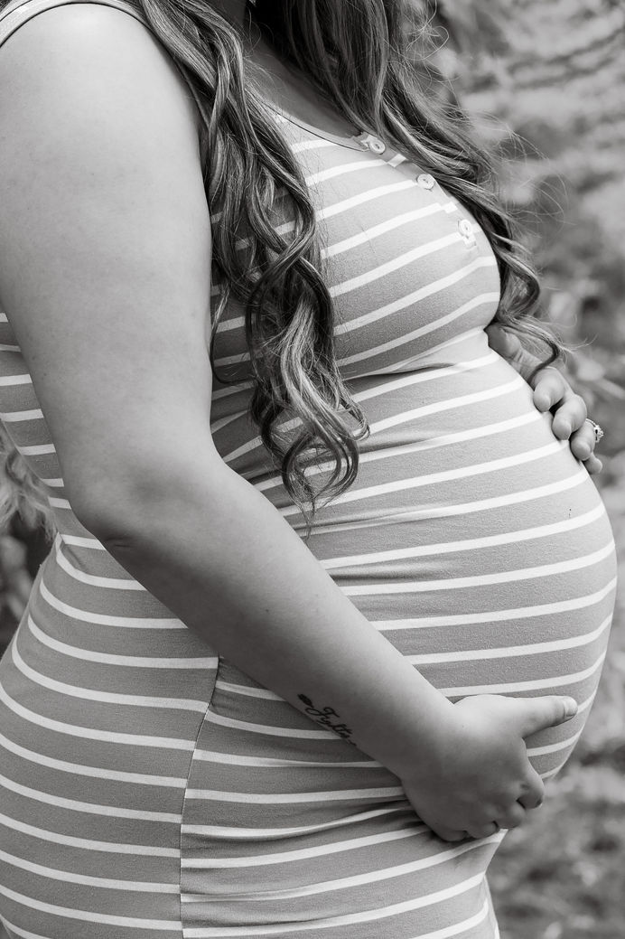 Expecting mother in a flowing dress | Best Oregon maternity photographer for pregnancy portraits