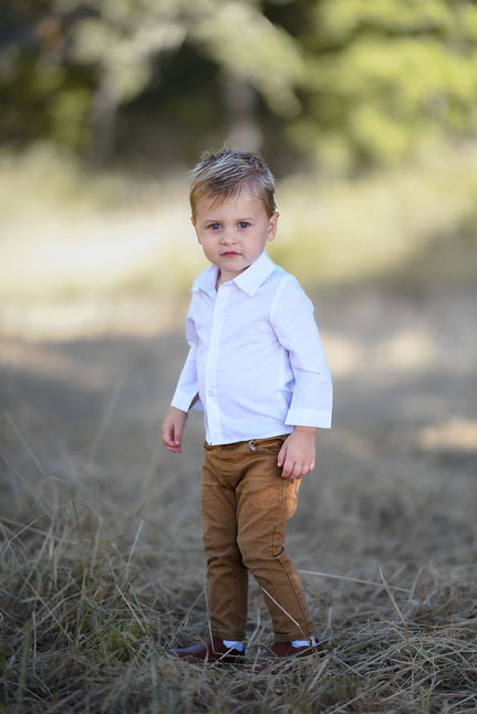 Parents and children laughing together outdoors | Professional family portraits in Oregon