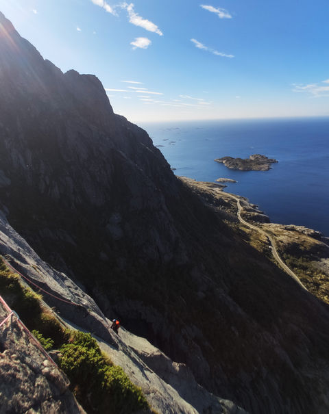 Sharp mountain ridges of Lofoten – A spectacular view of jagged peaks extending over the sea, a paradise for climbers and hikers.