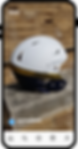 White, gold, and navy blue sports helmet on a stone wall.