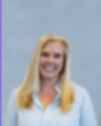 Smiling woman with long blonde hair wearing a light blue collared shirt. Women Business Owner