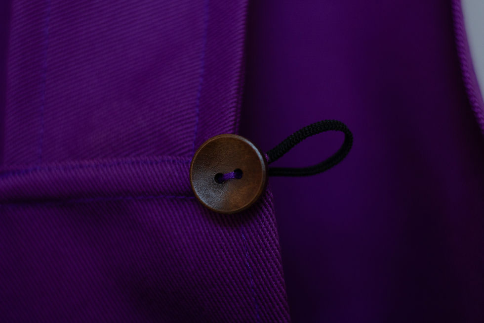 Thumbnail: deep purple twill weave cotton cross back apron's detail  - wooden button with elastic loop