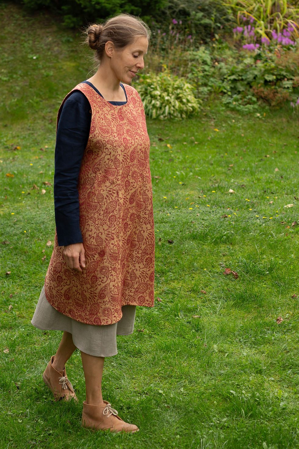 Thumbnail: Apron dress in paisley pattern jacquard weave, maroon and mellow yellow colours. Knee length.
