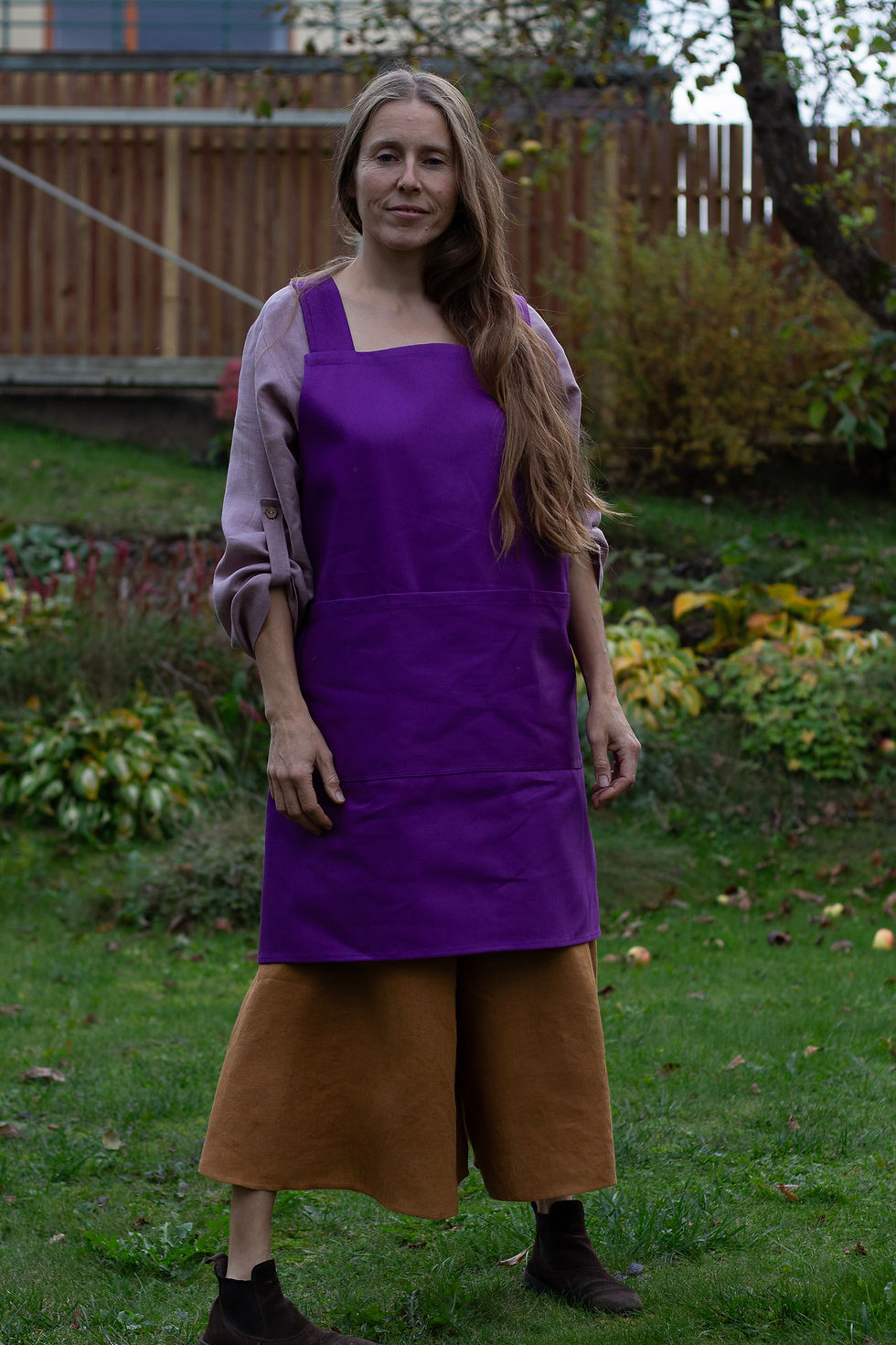 Thumbnail: Long hair woman with deep purple colour apron from sturdy cotton twill with pockets