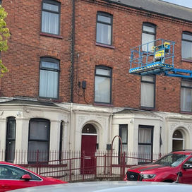 cherry picker cleaning building
