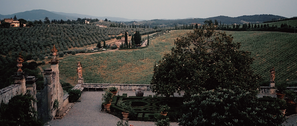 View of the Italian gardens at Villa Corsini Mezzomonte overlooking the Tuscan countryside