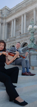 E&B musicians violinist Erika Sato and guitarist, Brian Turnmire pose on the steps of Library of Congress in Washington, D.C.