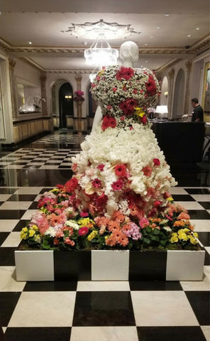 This project was for The Met Gala a few years ago honoring Karl Lagerfeld's floral dress.  This is J Cellan Design's take on that dress  showcased inside the lobby of The Pierre Hotel. The design involved custom building a matching checkered platform to stage an all white polished mannequin with the floral dress built around the mannequin by hand. 