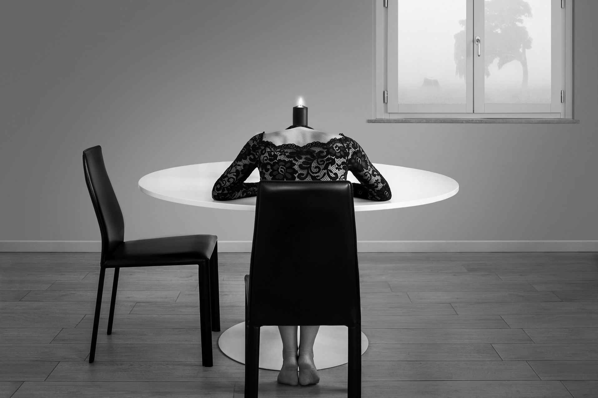 Award Winning black and white fine art photography, a lonely girl in front of the table with a candle. Fine art self-portrait