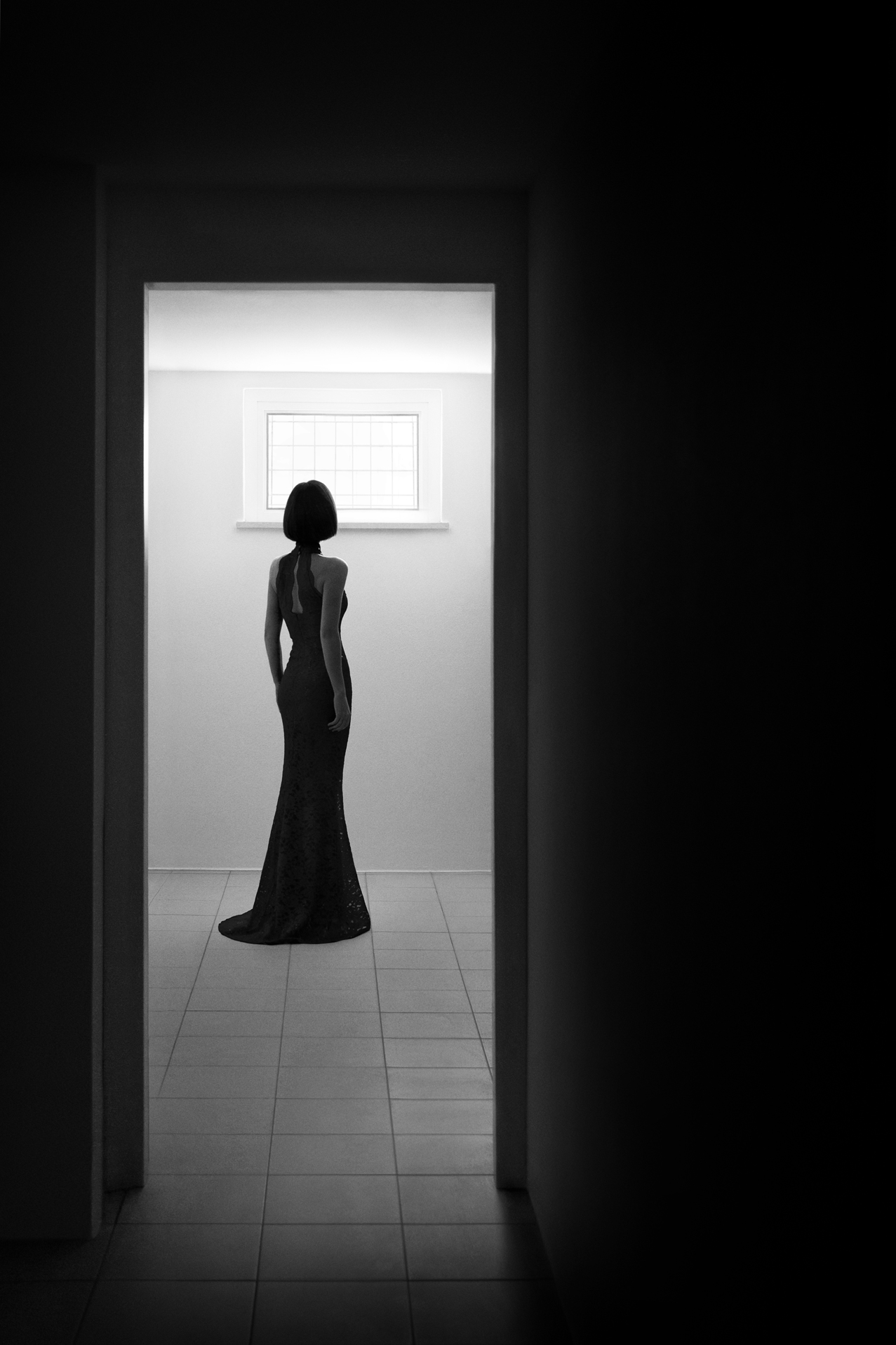 This is a black and white fine art photograph, that explores the various quests encountered throughout a person's life, and particularly those of an artist. The work allegorically symbolizes a human being’s search for inner freedom, employing metaphysical space as a concept to highlight the theme of the individual’s loneliness in any form of life’s quest, in the end.