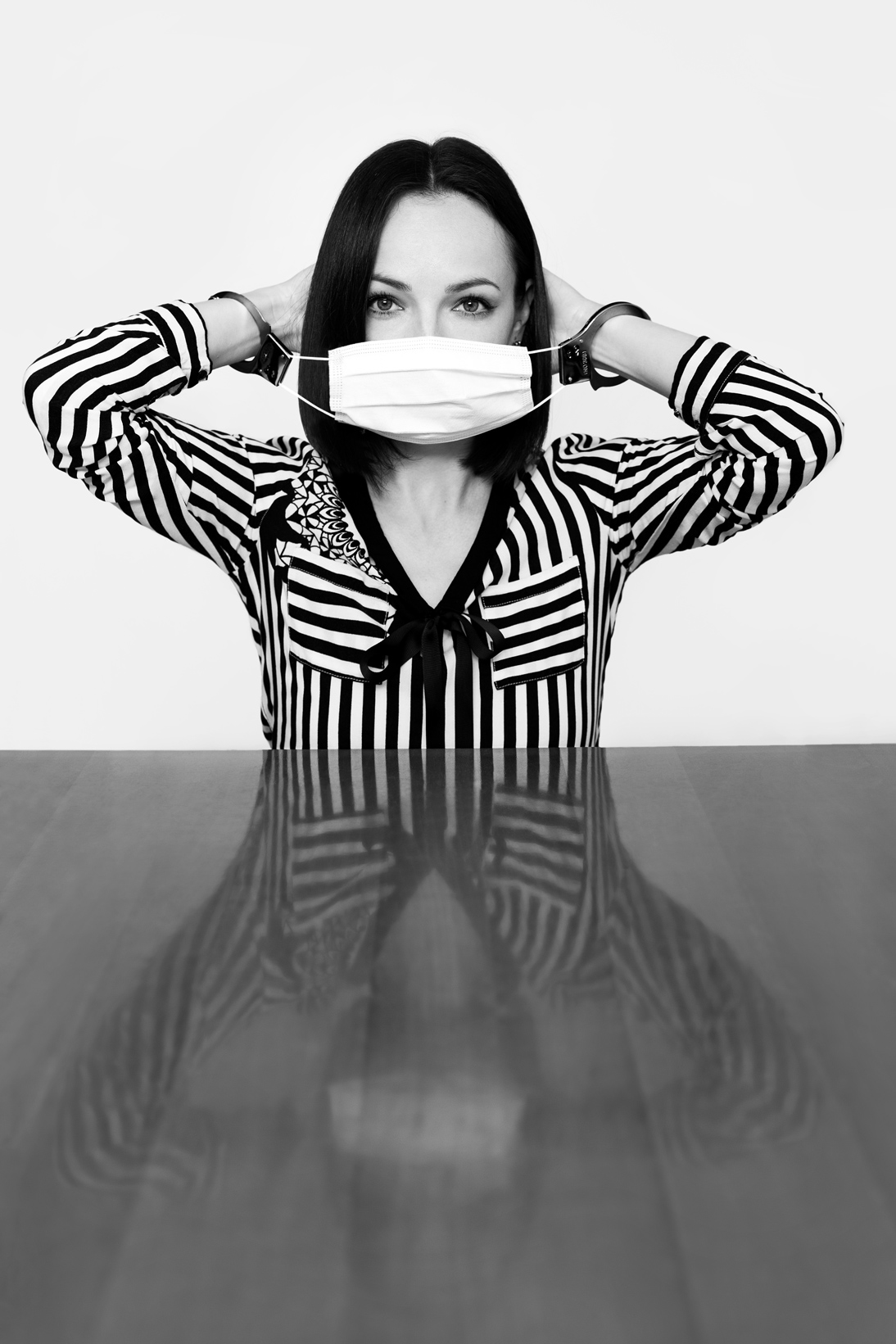 Award Winning black and white fine art photography.  A girl with the mask represents freedom of speech. Fine art self-portrait