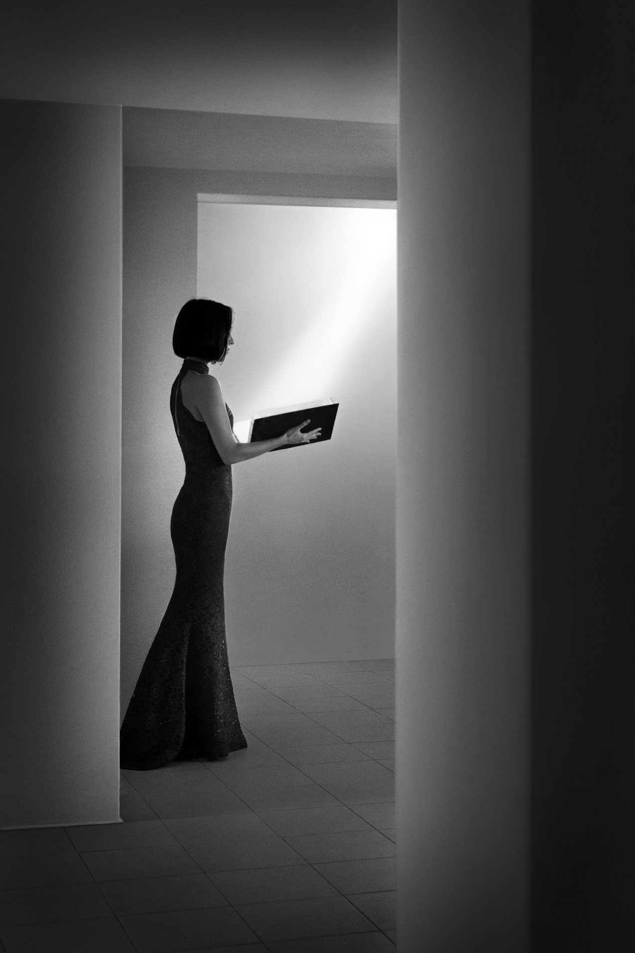 This is a black and white fine art photograph, that explores the various quests encountered throughout a person's life, and particularly those of an artist. The work allegorically symbolizes a human being's search for answers to existential questions, and invokes a metaphysical space as a concept to highlight the theme of the individual’s loneliness in any form of life’s quest, ultimately.