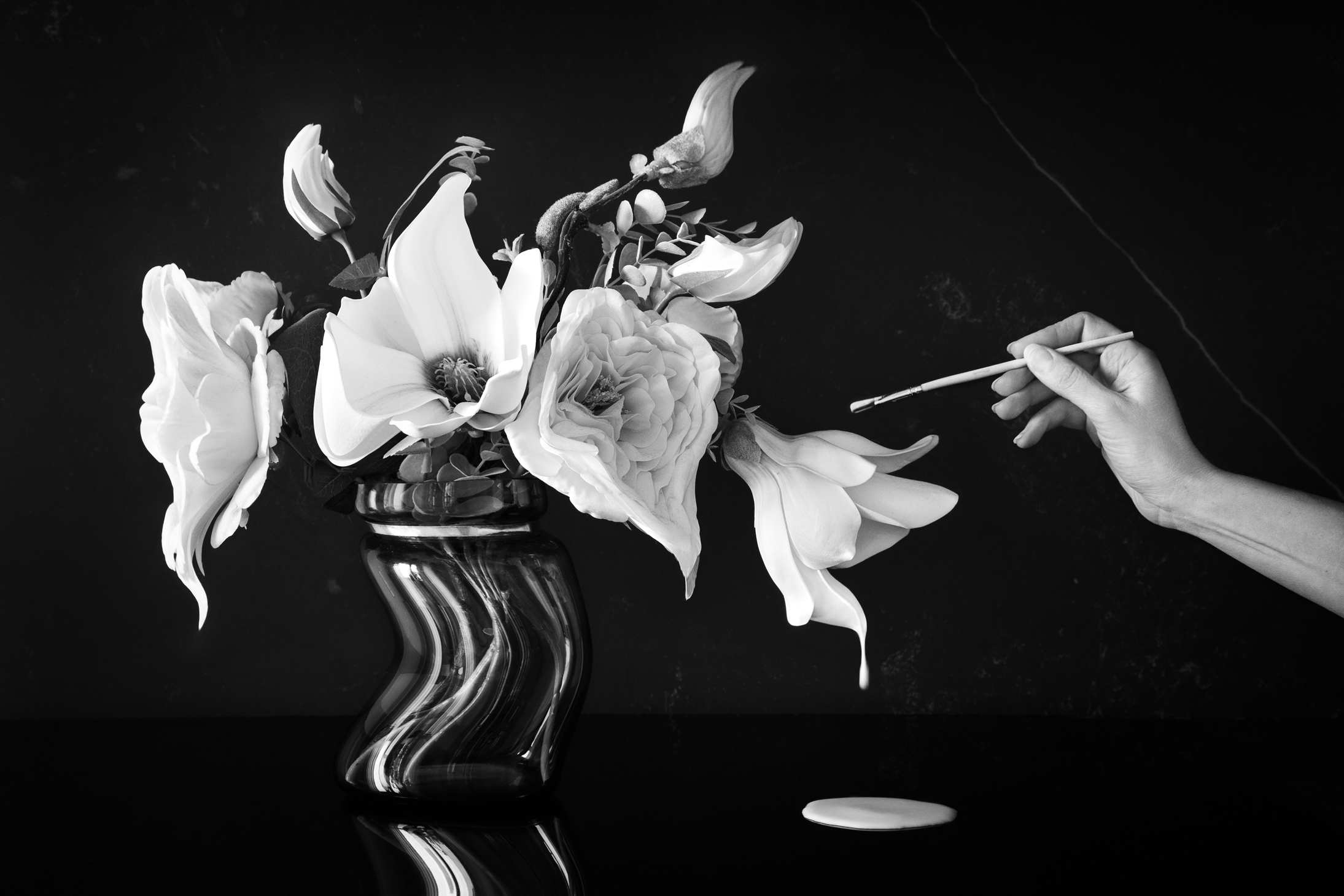 Beautiful black and white Fine art photograph showing a vase with flowers  that was created by an artist
