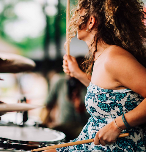 A woman playing the drums
