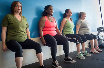 women wall sitting fitness gym.jpg