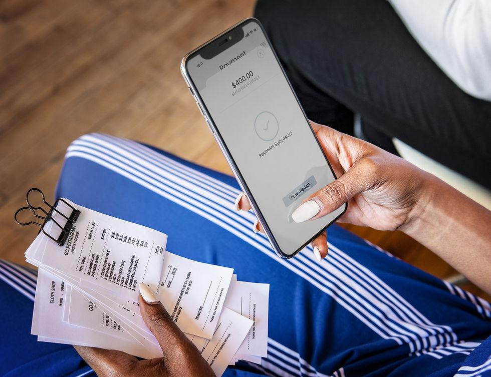 A person holding printed receipts in one hand and a smartphone showing a successful $400 payment with the option to view the receipt—illustrating digital and physical donation receipt compliance in Canada.