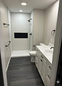Complete bathroom renovation in Pennsylvania featuring a new vanity, tiled shower, and flooring by FrontRunner Construction.