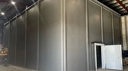 Precision-engineered modular vault room panels during assembly, offering scalable security for banks and cannabis dispensaries.