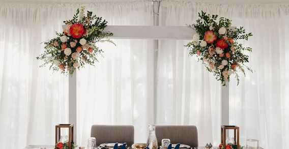 Sweethearts table with arch and farmhouse table, mr and mrs wood signs