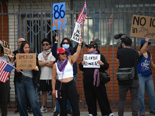 No Kings protestors line up in the Historic Filipinotown neighborhood of downtown Los Angeles