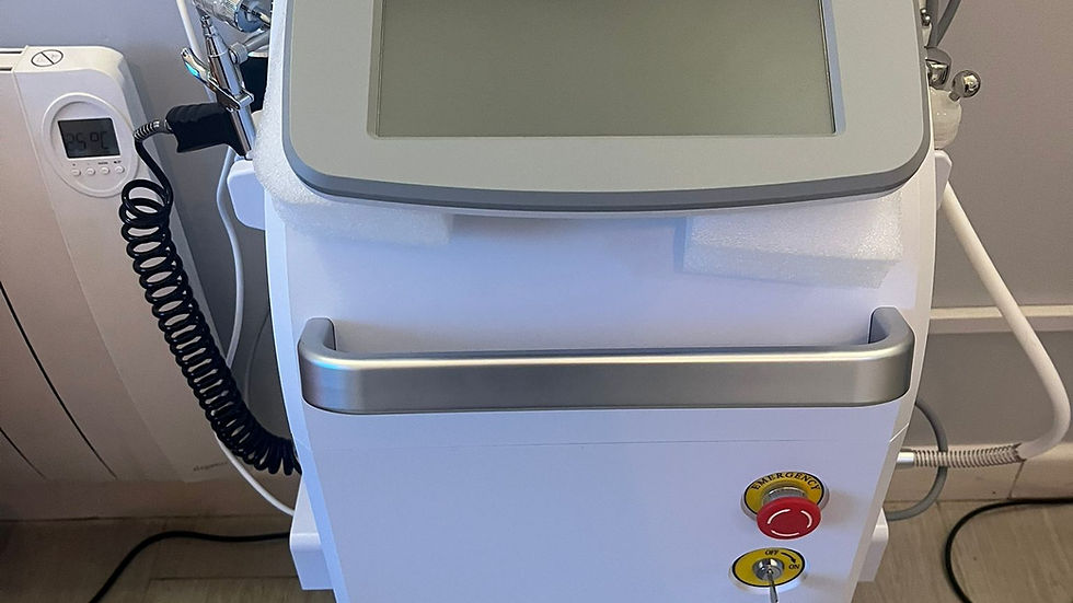 Hydro facial machine with a touchscreen, buttons, and dials on a wheeled base. It's white with metallic accents, set on a wood floor.