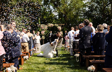Charming streamside wedding ceremony setup and private outdoor event spaces at Barn Swallow Farm in the Lehigh Valley.