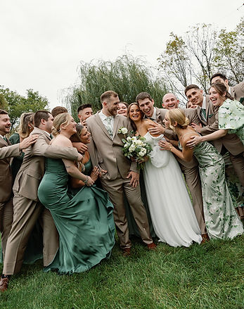 Wedding guests socializing and enjoying drinks during outdoor cocktail hour at Barn Swallow Farm in Northampton, Pennsylvania