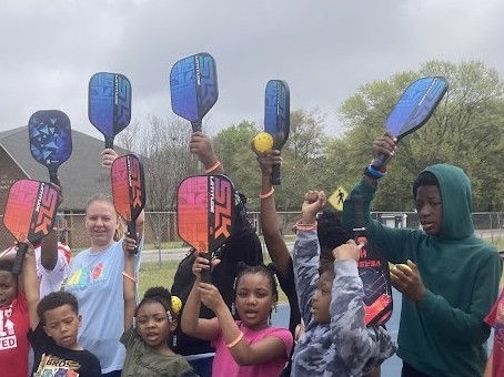 Salvation Army youth raise pickleball paddles