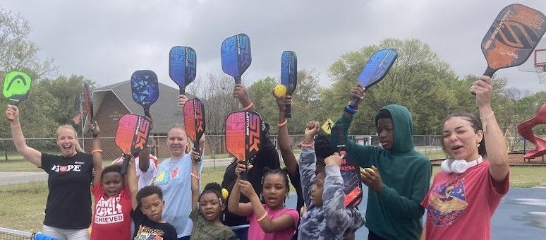 Salvation Army youth raise pickleball paddles