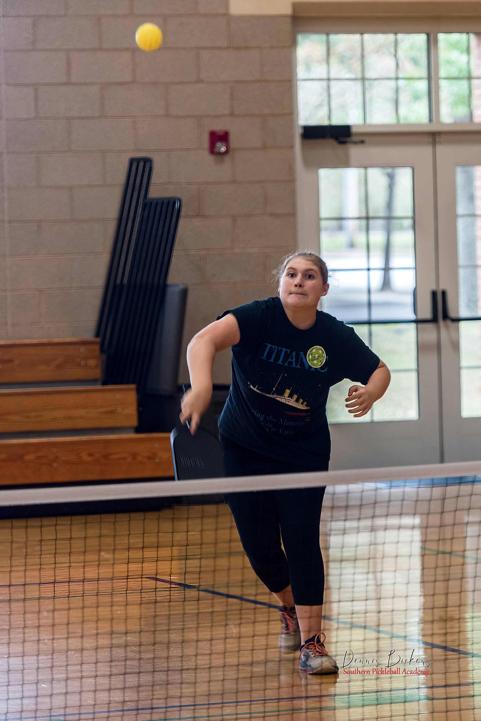 Izzy skillfully returns an overhead lob