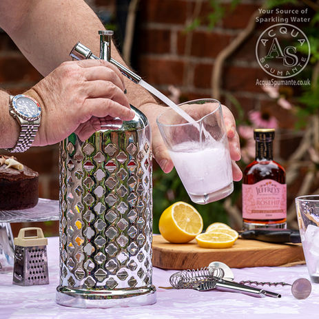 Silver siphon being used with a glass.jpg