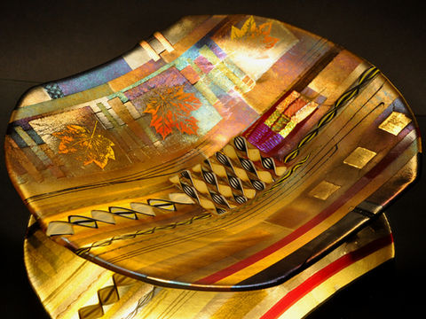 Fused glass platter with leaf motifs and warm amber tones