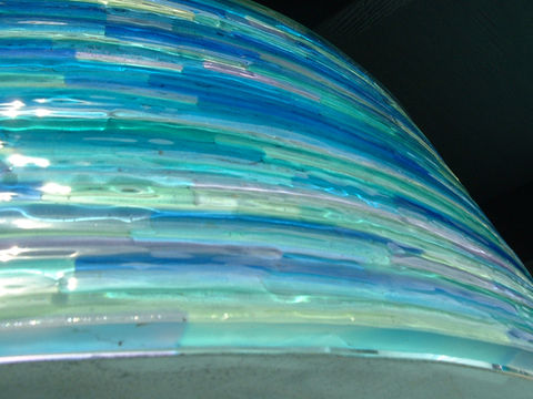 Detail of custom exterior light showing fused glass strips.