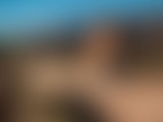 Adventure bike rider on a BMW 1200 GS tackling gravel roads in South Africa’s Cederberg mountains.