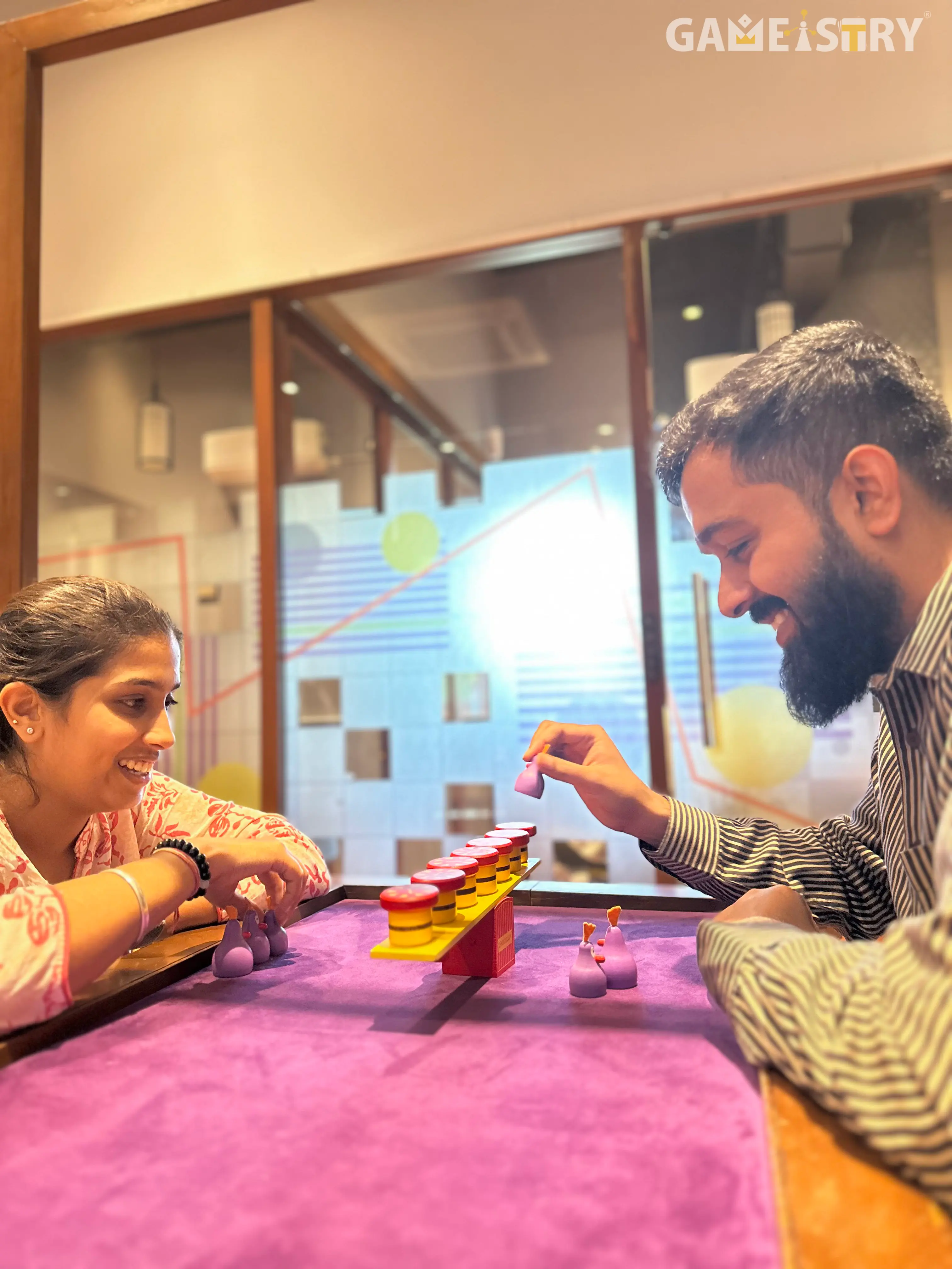 Two people playing the Board Game Chickyboom