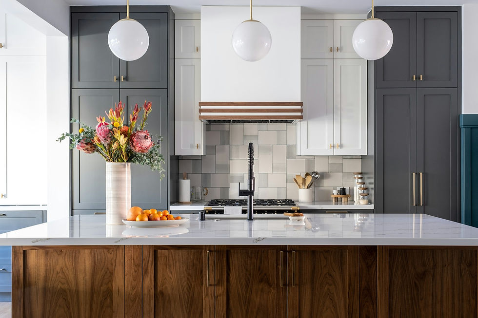 Luxury kitchen with vented range hood and pendant lighting for an open concept kitchen remodel in Houston