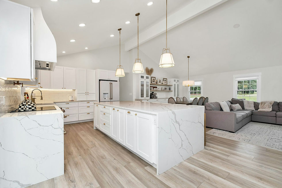 Completed luxury open concept kitchen remodel in Houston with white marble island and living area