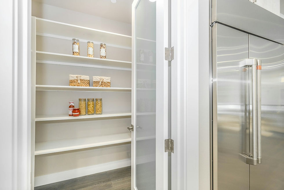 Illuminated glass display cabinet with interior LED lighting in a modern European kitchen