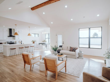 Open concept kitchen remodel in Houston TX with a kitchen island flowing into a bright living room