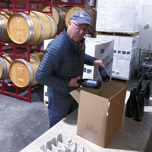 Owner Kevin packing wine club releases for shipment