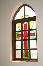 One of the church windows, decorated with stained glass.