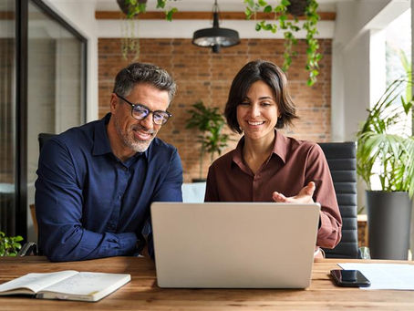 Man and woman talking over business