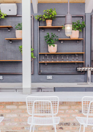 Installed live plants for newly constructed outdoor patio for a restaurant in Chicago, IL. Assortment of floor and hanging plants.