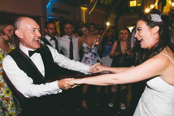 Bride and father dancing with guests at Botleys Mansion