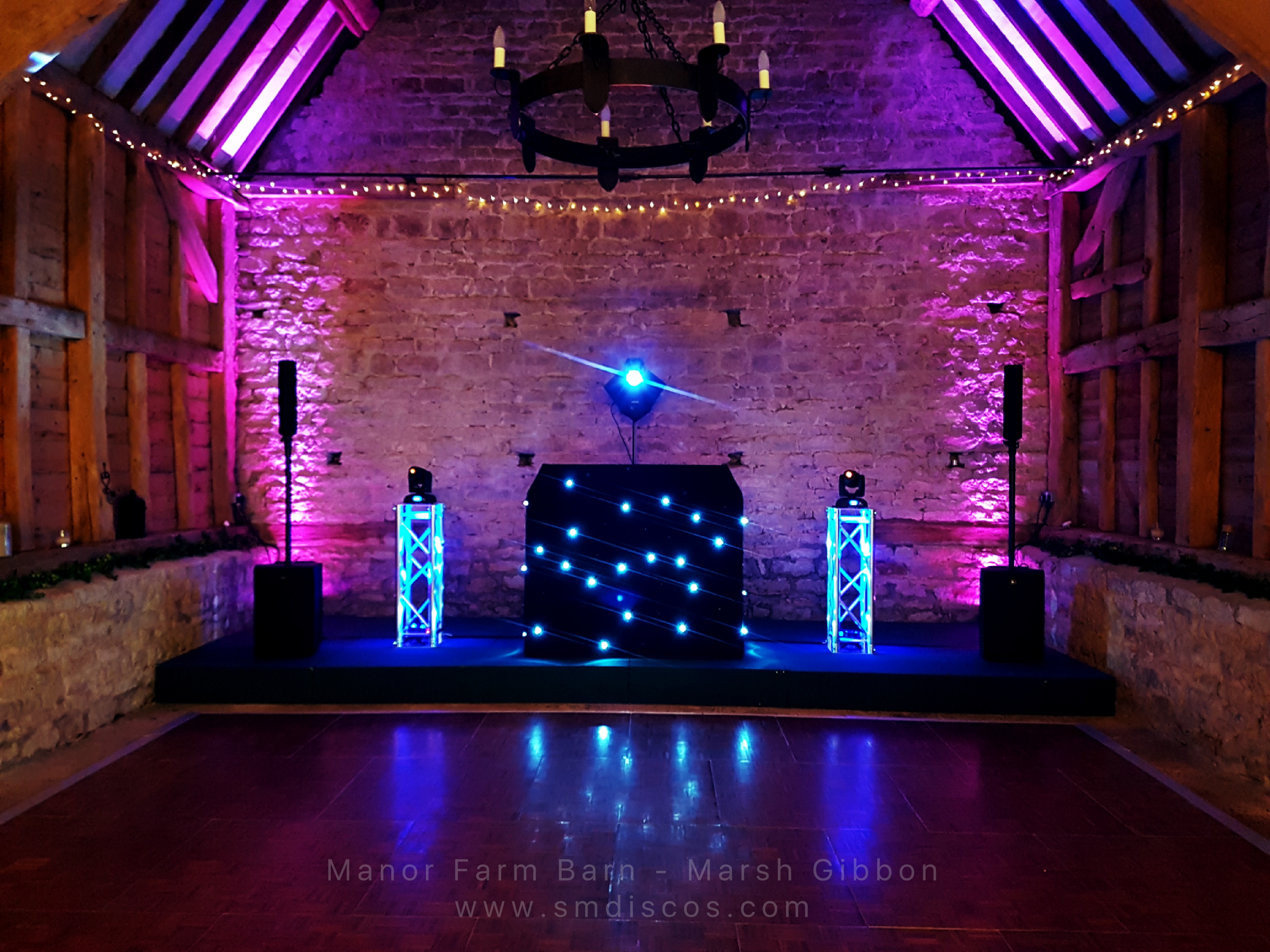 Wedding DJ rig & booth with mood lighting at Manor Farm Barn