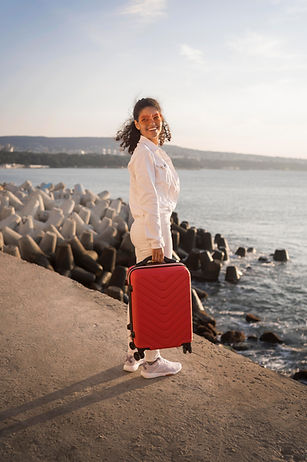 full-shot-woman-posing-with-baggage.jpg