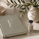 Forma Wellness journal and medicine bottle