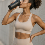 Fitness woman drinking water